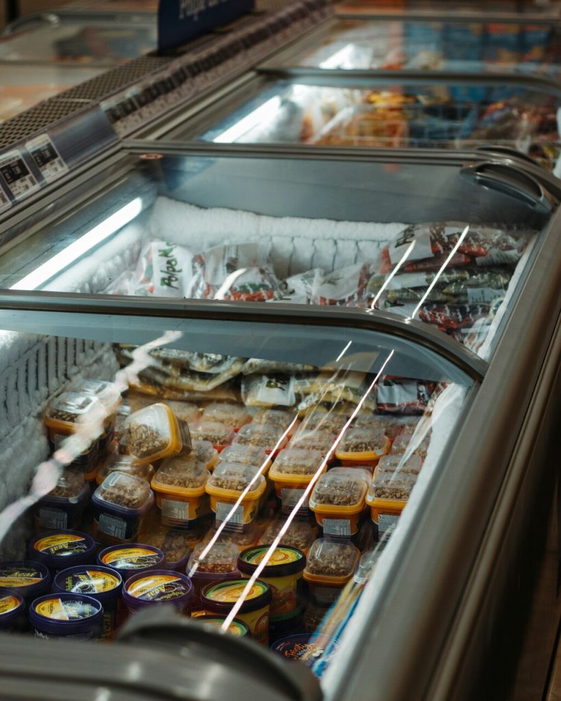 freezer filled with goods in a grocery store