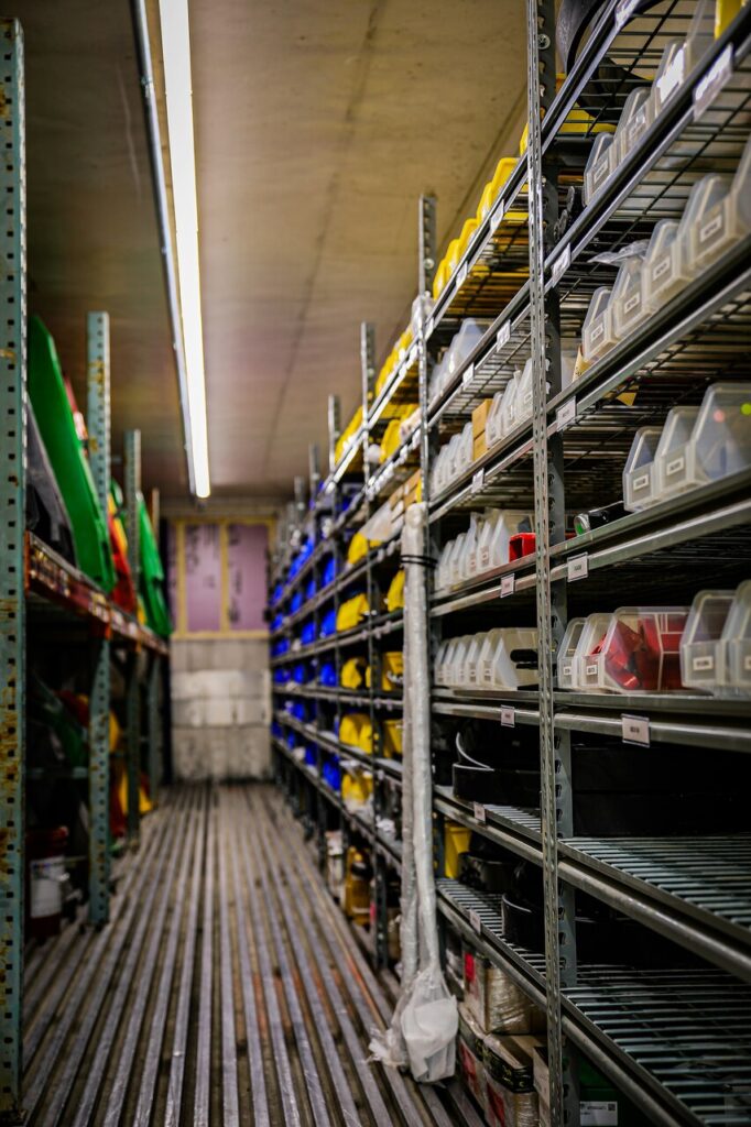 a room filled with many shelves filled with containers in a home appliance service